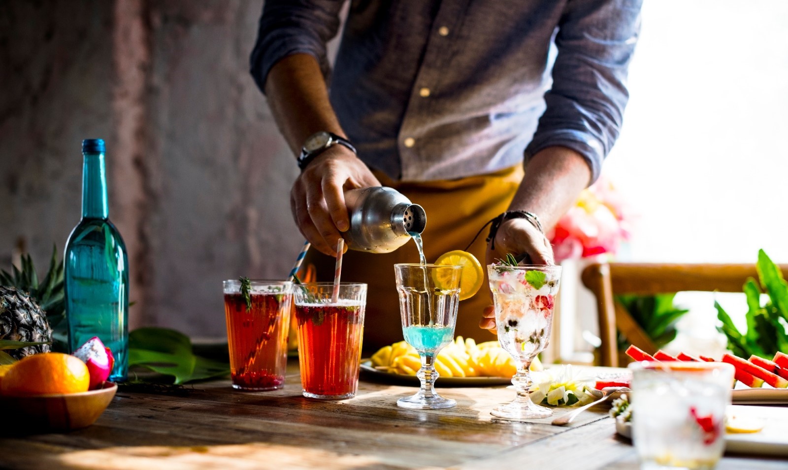 A person pouring drinks into glasses

AI-generated content may be incorrect., Picture