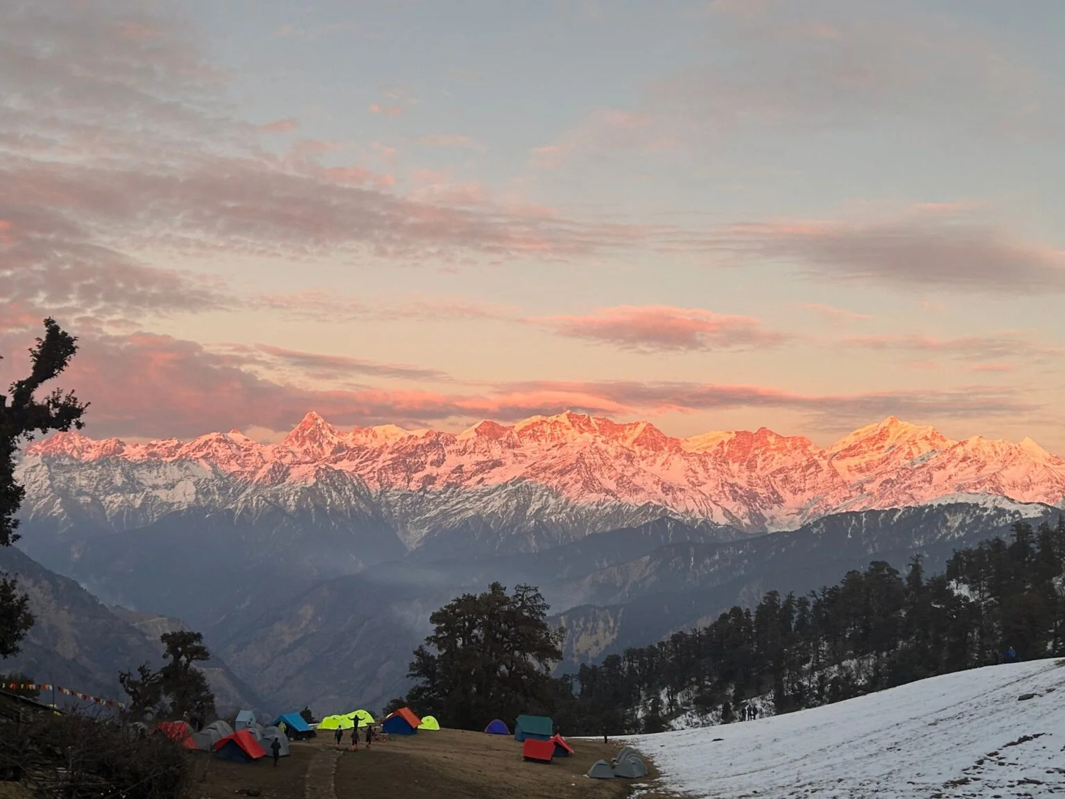 Sunrise over Dayara Bugyal, casting golden light on the grasslands